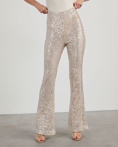 Bring glitz and glamour to your nightlife with the Diva Sequin Flare Pants! Made from shiny sequin fabric, these pants sit high with a fitted waist, straight leg fit and side zipper closure. Pair it with a neutral top or the matching Diva Sequin Bubble Hem Top. Fitted waist – non-stretch Straight leg fit Side zipper, hook & eye closure Sequin fabric with lining Shell: 100% Polyester, Lining: 80% Polyester 20% Cotton Flare Sequin Pants, Sequence Pants, Diamond Pants, Sparkly Pants, Sequin Flare Pants, Sheer Pants, Elephant Pants, Neutral Tops, Glitz And Glamour