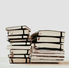 a stack of books sitting on top of each other