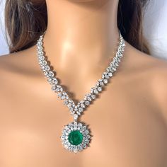 * Necklace Length - 17 -20 inches (adjustable) * Necklace Width - 1.5 Inches * Earrings Length - 2 inches * Earrings Width -0.3 inches Add a touch of timeless elegance to your jewelry collection with this exquisite Green Silver American Diamond Pendant Necklace Set. Crafted from high-quality 18K rhodium Brass, this set features meticulously faceted green and clear CZ American diamonds that sparkle brilliantly with every movement. The necklace showcases a stunning pendant design, adorned with a c Adjustable Crystal Pendant Jewelry, Green Dangle Necklaces For Anniversary, Green Dangle Necklace For Anniversary, Formal 16 Inch Pendant Jewelry, Green Jewelry With Adjustable Chain For Anniversary, Green Adjustable Chain Jewelry For Anniversary, Formal Round Pendant Jewelry With Jewels, Crystal Dangle Necklaces For Anniversary, Formal Dangle Necklaces With Jewels