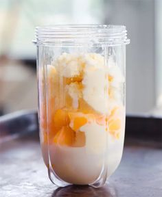 a glass jar filled with food sitting on top of a table