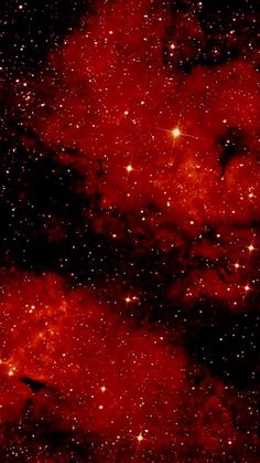 an image of some red stars in the sky