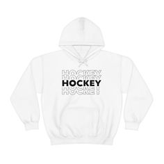 Hockey 5X - Women's Hooded Sweatshirt This unisex heavy blend hooded sweatshirt is relaxation itself. Made with a thick blend of cotton and polyester, it feels plush, soft and warm, a perfect choice for any cold day. In the front, the spacious kangaroo pocket adds daily practicality while the hood's drawstring is the same color as the base sweater for extra style points. .: 50% cotton, 50% polyester (fiber content may vary for different colors) .: Medium-heavy fabric (8.0 oz/yd² (271 g/m .: Clas Hockey Sweater, Hockey Hoodie, Women's Hockey, Clothing Shopping, Hooded Sweatshirt Men, Mens Hooded, Heavy Fabric, Kangaroo Pocket, Hooded Sweatshirt