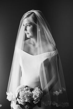 black and white photograph of a bride in her wedding dress