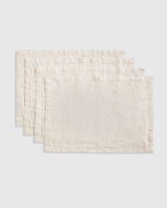 four linen napkins on a white background