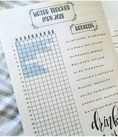 an open notebook with water tracker on it and the words drink list written in cursive writing