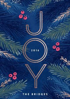 a blue christmas card with the words joy on it and evergreen branches in gold lettering