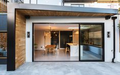 an open patio with sliding glass doors leading to the dining room and living room area