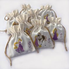 four bags with princesses on them sitting next to each other