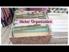 an organized file box with stickers on it and the words sticker organization in pink