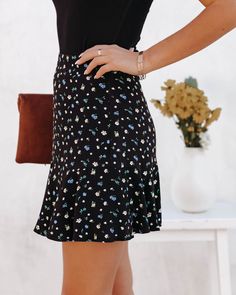 True to Size Shellâ€?50% Rayon and 50% Viscose and Liningâ€?100% Rayon Hand Wash Cold. Dry Flat Mini Length Structured Waistbandâ€?Non-Elastic Flowy Skirt Concealed Side Zipper Closure Fully Lined Spend all day flirting in the Filipa Floral Mini Skirt in black with blue. ivory. olive. and pale orange florals and a structured waistband.Styled with: Perfect Hoops. Bar Burst Necklace. Simple Bangle. Stella Clutch. Georgina Top. and Cooper Sandal.---SIZE AND FIT---Model is Wearing a Size Small. Heig Black Floral Print Skirt For Summer, Fitted Black Bottoms For Brunch, Black Summer Bottoms With Mini Hem, Black Fitted Mini Skirt, Black Skirted Bottoms For Spring, Casual Black Mini Skirt For Spring, Black Bottoms With Floral Print For Spring, Black Non-stretch Mini Skirt For Summer, Black Floral Print Skirt