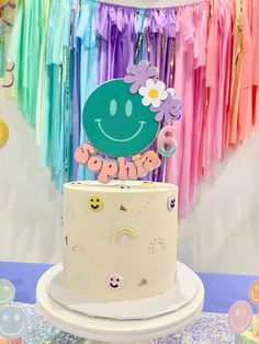 a birthday cake with a happy face on top