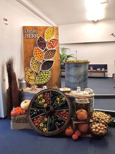 an assortment of fruits and vegetables on display in front of a sign that reads danke herr