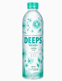 deep's green tea water is shown on a white background, with blue flowers and leaves