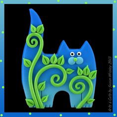 a blue cat with green leaves on it's tail is standing in front of a polka dot background