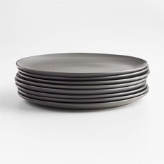 stack of black plates on white background