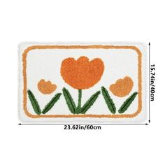 an orange and white door mat with tulips in the center on a white background