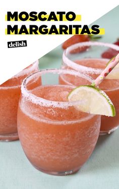 three glasses filled with watermelon margaritas and strawberries