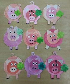 paper plate pigs with green leaves on them