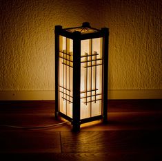 a lamp that is on top of a wooden floor