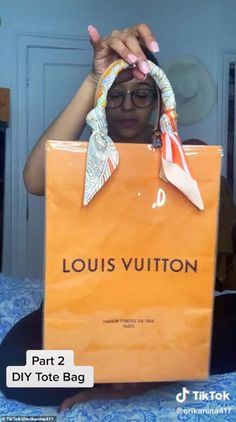 a woman holding up a louis vuitton bag in front of her face with the words part 2 diy tote bag on it