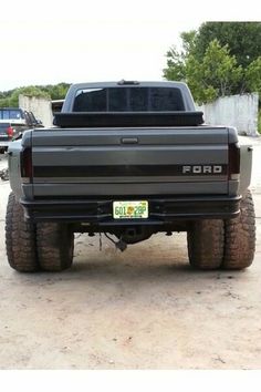 the rear end of a truck parked in a parking lot