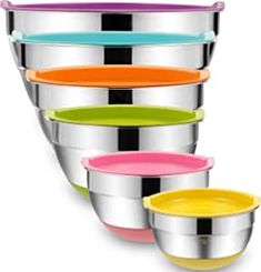 a stack of stainless steel bowls with different colors on each side and one in the middle