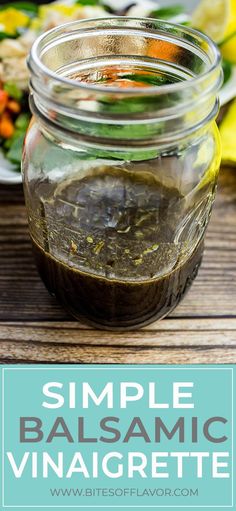 a jar filled with balsamic vinaigrete sitting on top of a wooden table