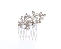 Make a statement on your special day with this exquisite Charming Vintage Floral Hair Comb. This delicate bridal headpiece boasts a captivating floral design that evokes a sense of femininity and grace. Handcrafted with precision, this vintage-inspired hair comb is the perfect accessory for brides seeking a touch of old-world charm. Elevate your wedding day look with the subtle sophistication of this heirloom-quality piece. From intricate details to timeless appeal, this hair comb is a true embo Floral Hair Comb, Wedding Barrettes, Floral Hair Combs, Floral Accessories Hair, Bride Hair Accessories, Bohemian Bride, Bridal Headpiece, Style Hair, Floral Hair