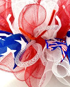 red, white and blue mesh wreath with american flag colors on the front for 4th of july