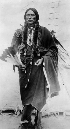 an old black and white photo of a native american man