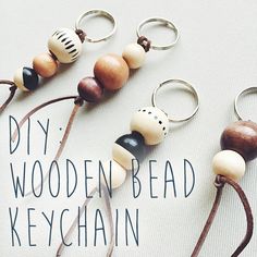 several wooden bead keychains are arranged on a white surface with the words diy wooden bead keychain