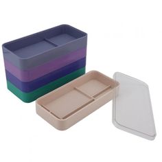 three different colored plastic containers with lids and dividers on each side, one is empty