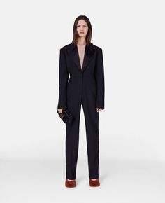 Luxury Long Sleeve Formal Pantsuit, Luxury Evening Pantsuit With Notch Lapel, Luxury Tailored Evening Pantsuit, Fitted Tuxedo-style Structured Pantsuit, Fitted Tuxedo Style Structured Pantsuit, Structured Tuxedo Style Fitted Pantsuit, Evening Suits With Structured Boning, Luxury Lapel Collar Semi-formal Pantsuit, Luxury Semi-formal Pantsuit With Lapel Collar