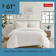 a bed with white comforter and pillows on it for $ 61 74 reg $ 156 00