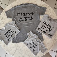 Limited Quantity! Trending Mama, Baby & Kids T-Shirt Bundle - Gray and Black  🌟 Elevate your family's style with this trendy and adorable Mama, Baby & Kids T-Shirt Bundle, available in chic gray and black colors! 🖤💫 🎁 Perfect Gift: This exclusive bundle is ideal for stylish moms, dads, and their little ones, making it a thoughtful gift for baby showers, birthdays, or family occasions. 👉 Bundle Includes: Total of T-shirts are 4 1 Adult size M Polyblend 1 Kids Gray 100% Cotton 2T 1 Kids Gray Trendy Family, Mama Tshirts, Black Family, Stylish Mom, Mama T Shirt, Boys Graphic Tee, Family Tees, Family Fashion, Baby T Shirts