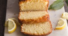 a loaf of lemon pound cake on a cutting board