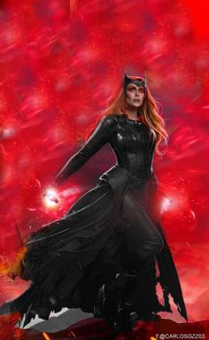 a woman dressed as catwoman standing in front of a red and black background with flames