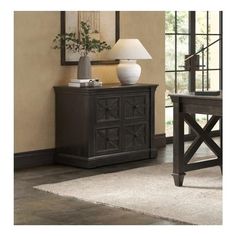 a living room scene with focus on the sideboard and lamp, along with an area rug