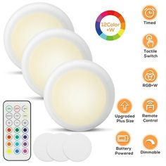 three white lights with remote controls on the side and four different color options for each light