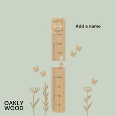 a wooden ruler with butterflies flying around it and the words,'add name '