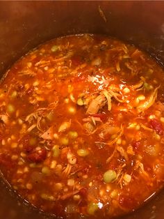 a large pot filled with soup sitting on top of a stove