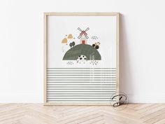 an art print on a wall with a wooden frame in front of it that has a landscape and windmills