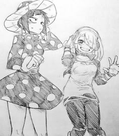 two girls in dresses and hats are standing next to each other with their fingers up