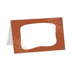 a blank card with an orange border and leaves on the bottom, in front of a white background