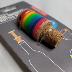 there is a spool of thread on top of the cork