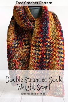 a crocheted scarf with text that reads double stranded sock weight scarf