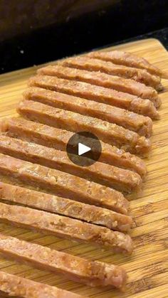 some food is laying on a cutting board and ready to be cut into smaller pieces