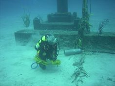 a scuba diver with a yellow rope attached to it