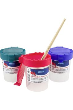 three different colors of paint with a wooden stick sticking out of the top and bottom