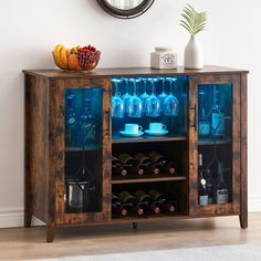 a wooden cabinet filled with bottles and glasses